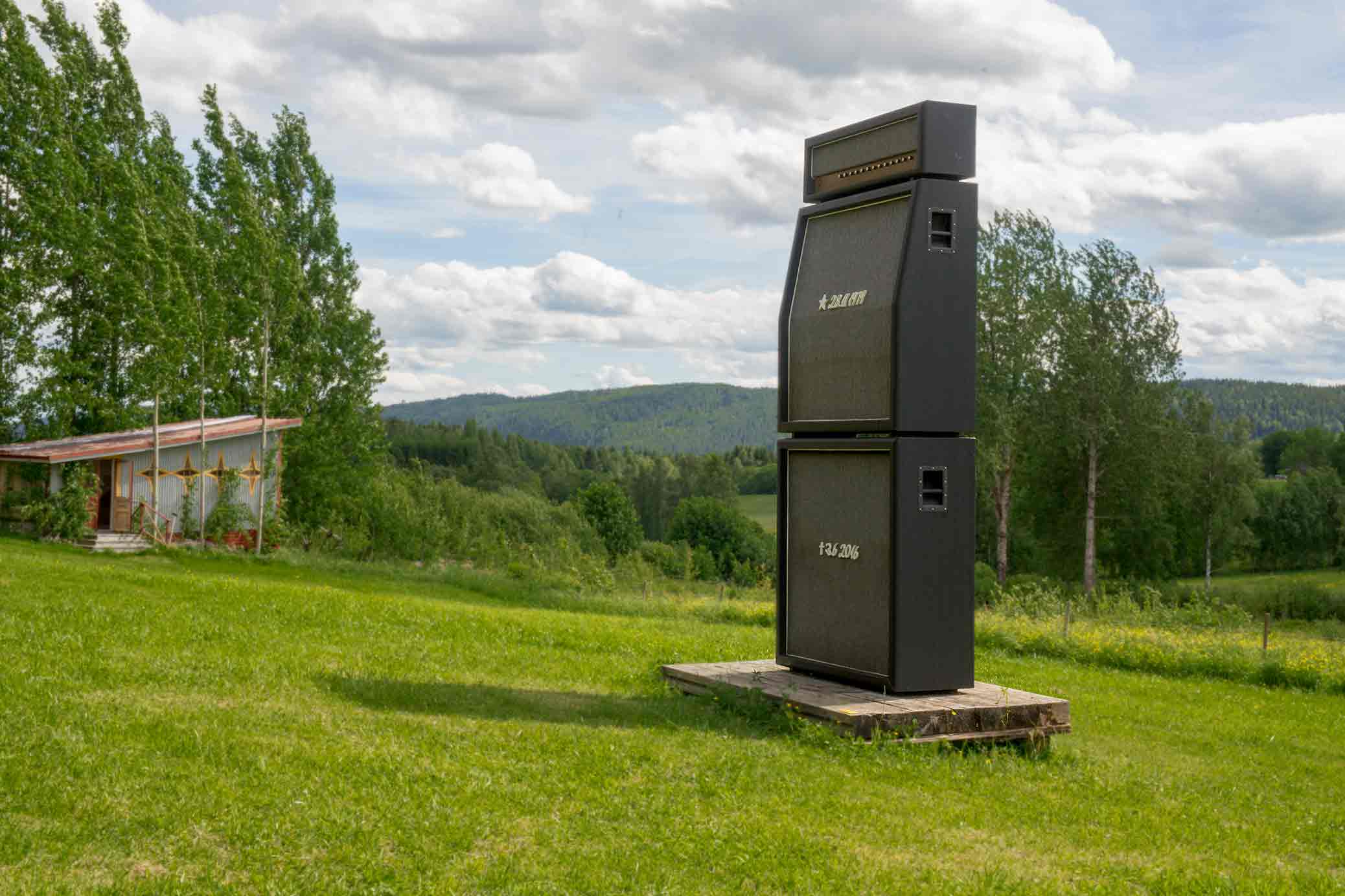 Alma Löv Museum 2017, Balancing The Books, a sound sculpture in the shape of a Marshall stack and a grave stone, out in the field.