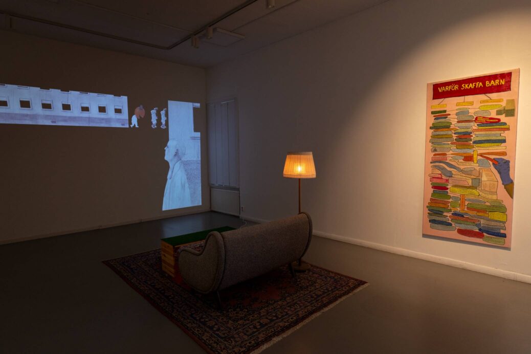 Video installation with animation, sofa, lamp and painting, all by Karl & Carl.