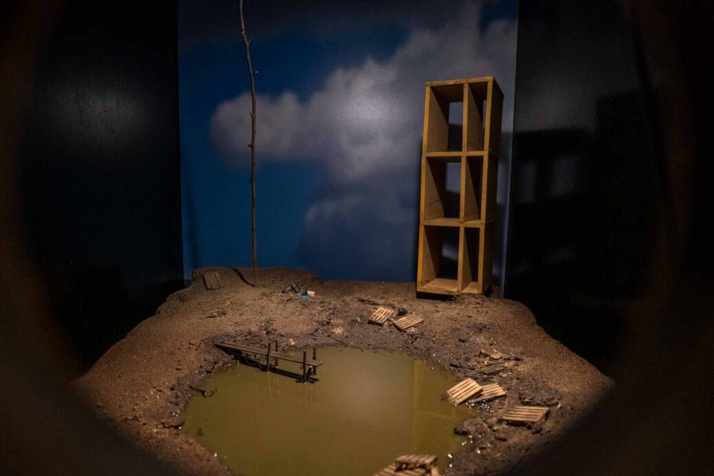 Diorama by Karl & Carl. Post-apocalyptic landscape with pond and debris.